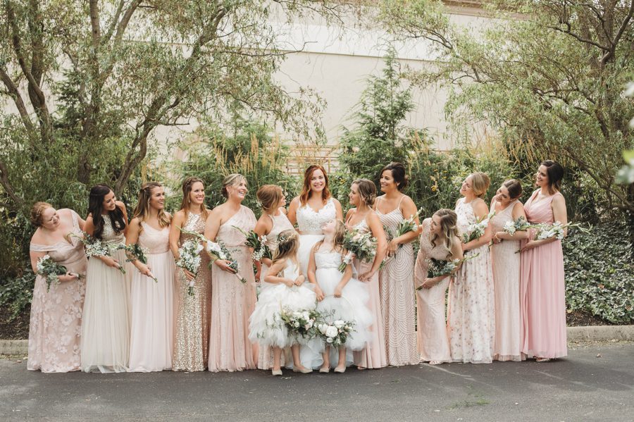 bride smiling with bridesmaids at Brookshire event center