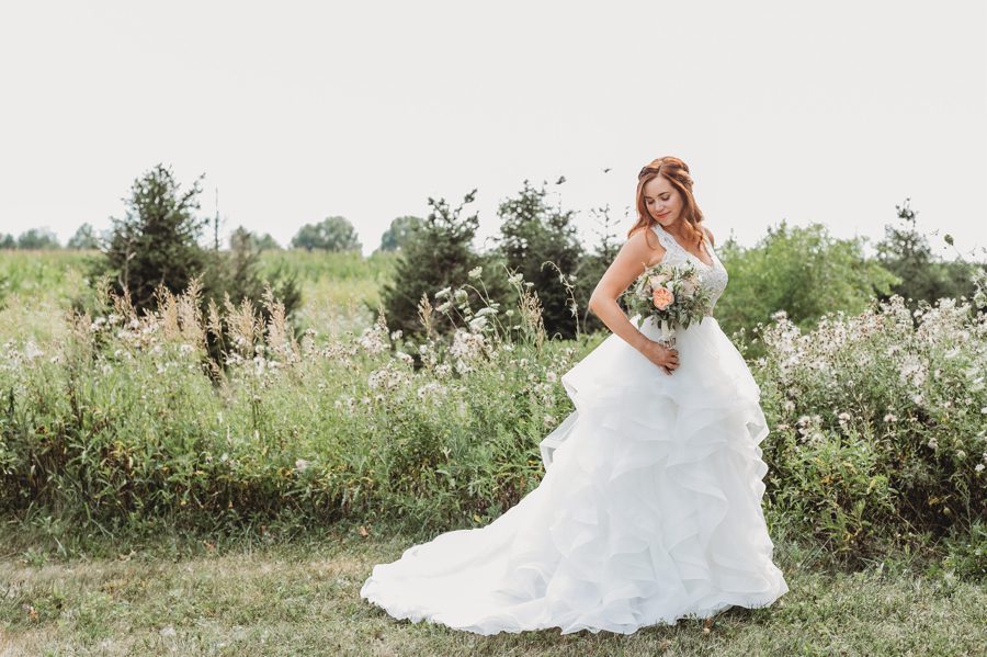 bride in field at Brookshire Event Center