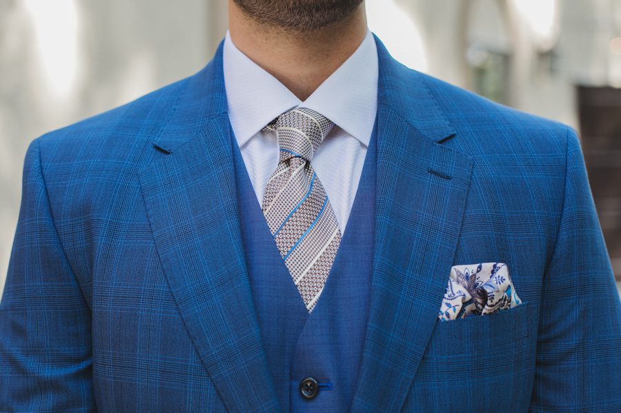 groom in blue suit and patterned tie