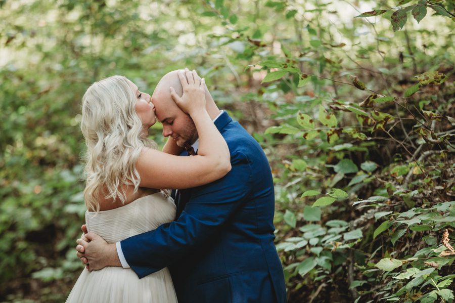 bride kissing grooms head