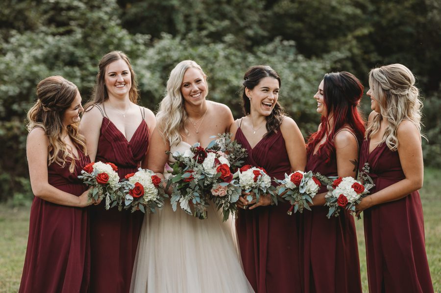 bride and bridesmaids laughing at Butler Ohio Wedding Photos