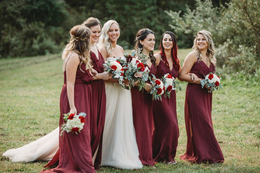 side angle of bride walking with bridesmaids