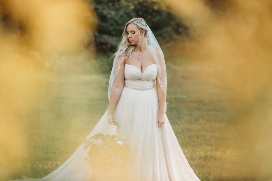 bride holding bouquet off to her side at Butler Ohio Wedding Photos