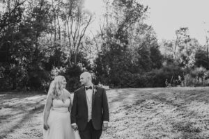 Butler Ohio Wedding Photos of bride and groom walking holding hands