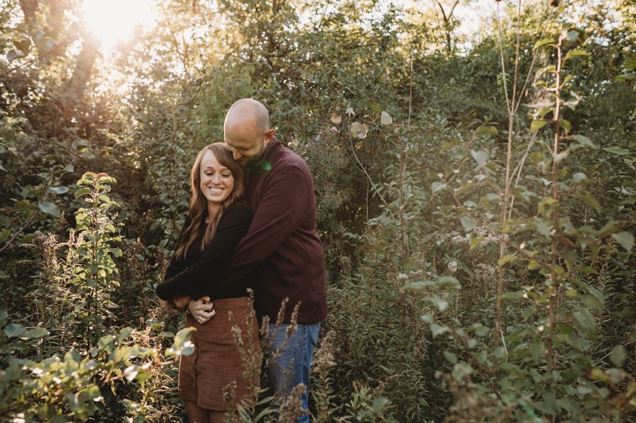 Engagement Photos at Grange Audubon with groom to be hugging fiancé