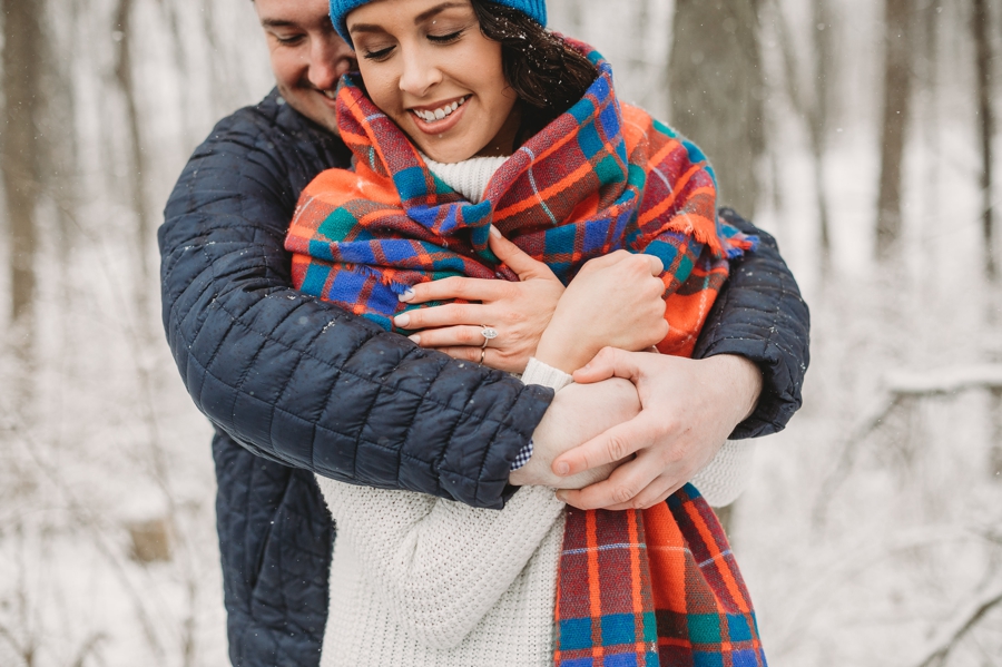 engaged couple with arms wrapped around each other at Hoover Reservoir Engagement