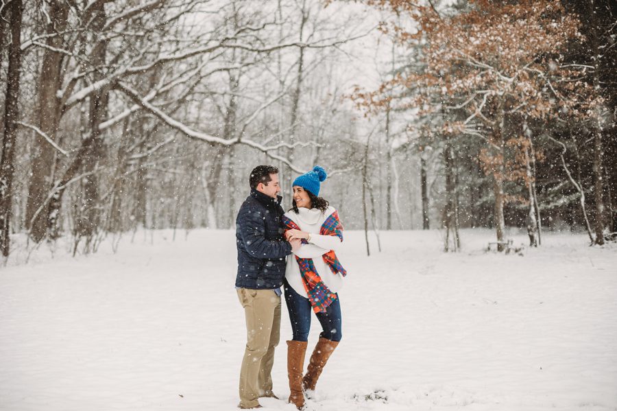engaged couple dancing in the snow at Hoover Reservoir Engagement