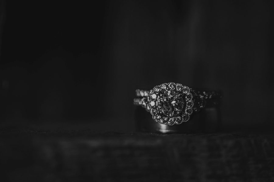 bald and white photo of wedding rings