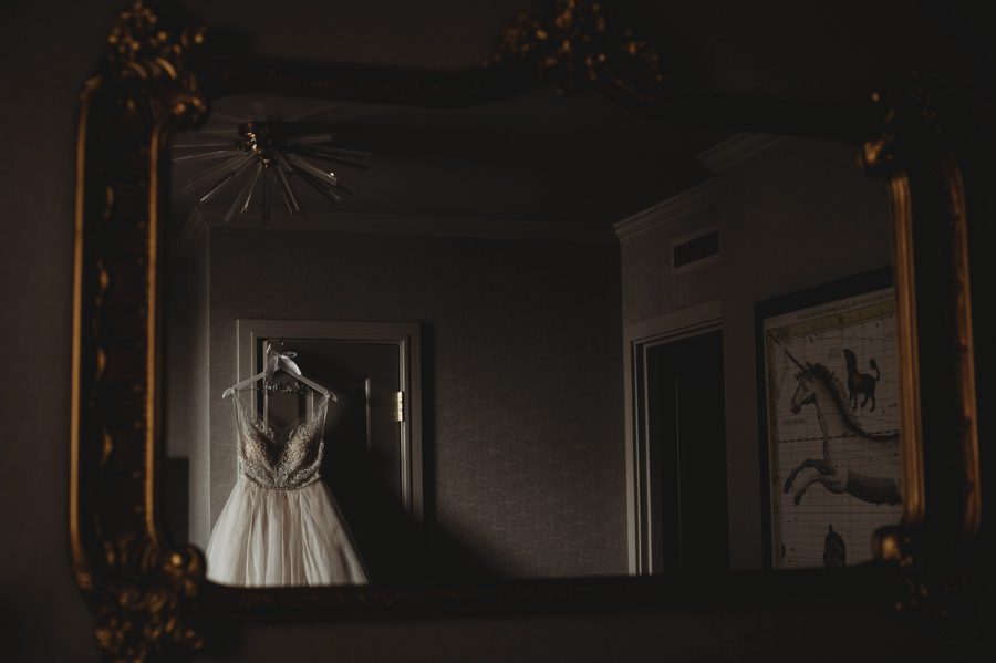 mirror reflection photo of bridal gown