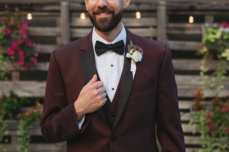 tuxedo details of groom in maroon