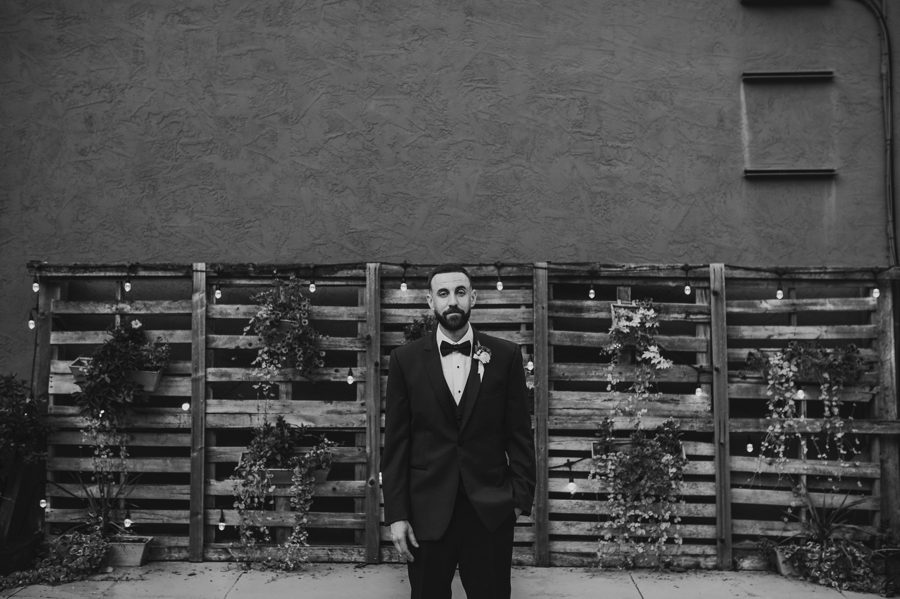 black and white photo of groom