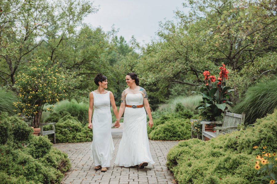 two brides walking holding hands at Inniswood Micro Wedding