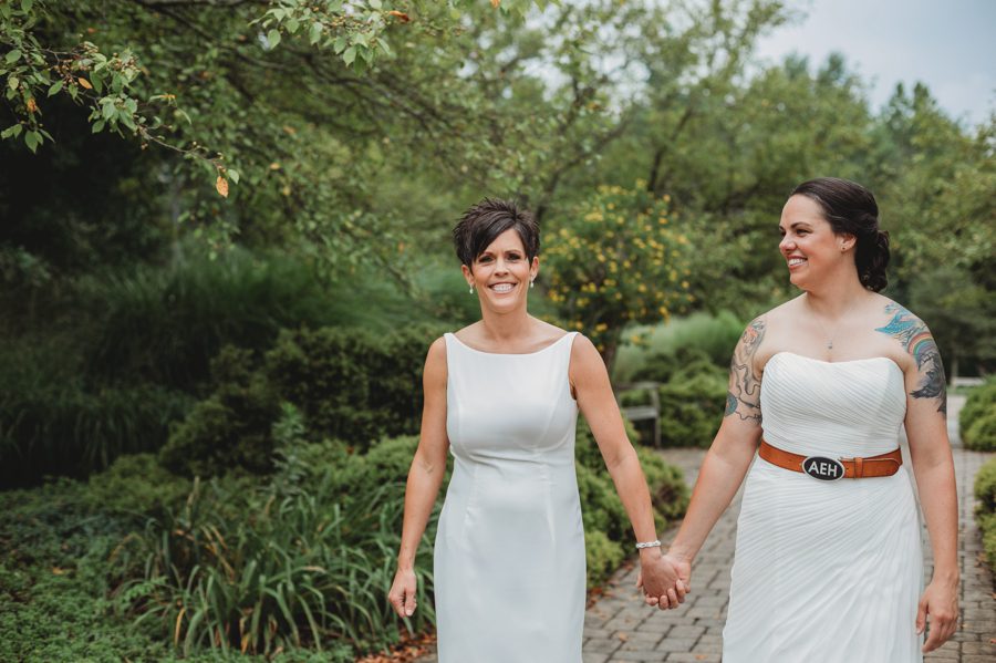 two brides walking hand and hand at Inniswood Micro Wedding