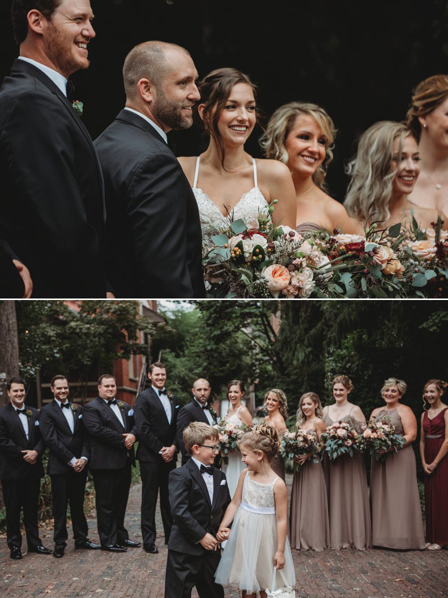 wedding party laughing at ring bearer and flower girl
