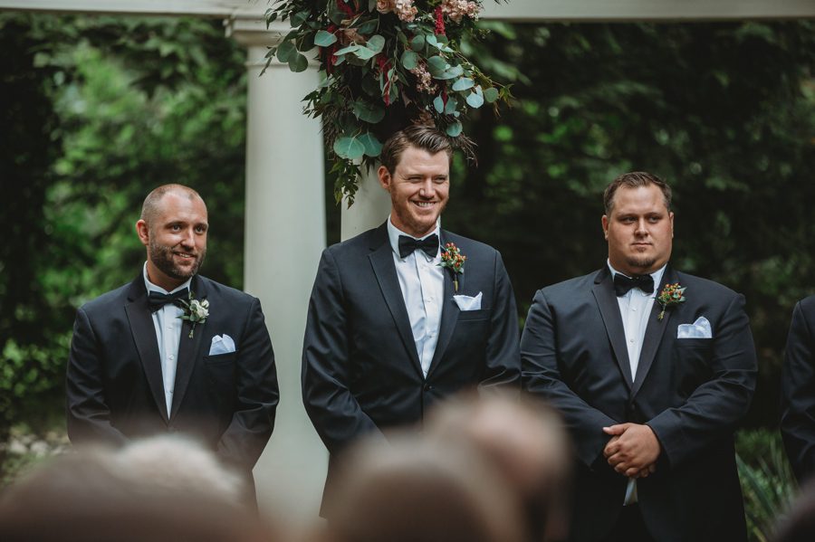grooms reaction to bride walking down aisle for wedding