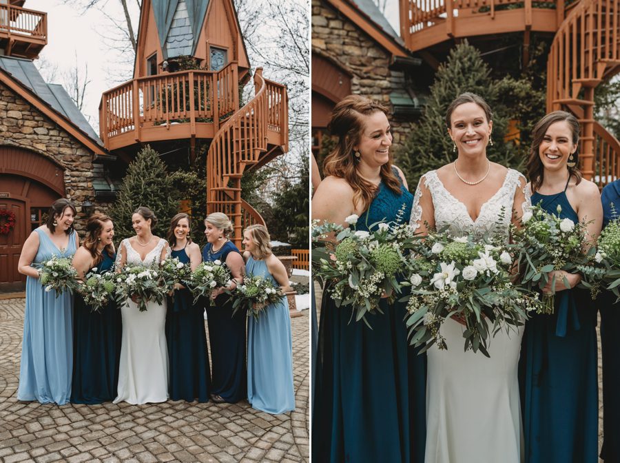 bride looking at bridesmaids smiling in front of spiral staircase