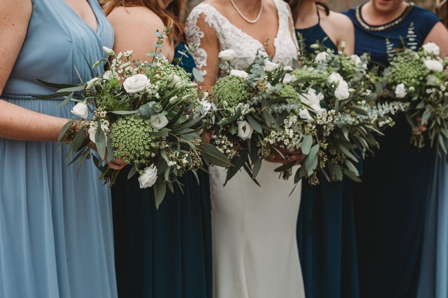 blue bridesmaids dresses with greenery bouquets at Landolls Mohican Castle Wedding