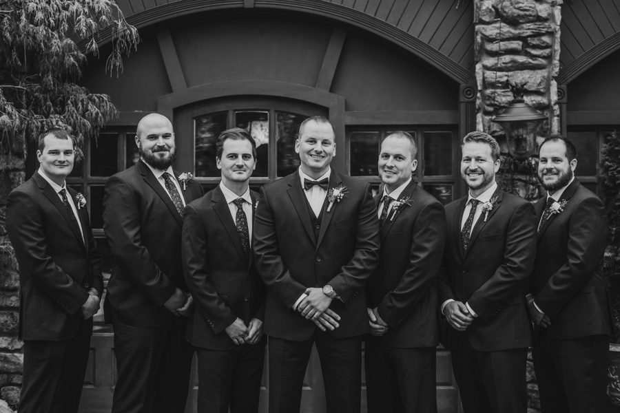 black and white image of groom and groomsmen at Landolls Mohican Castle Wedding
