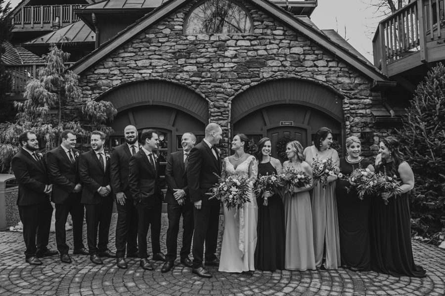black and white candid photo of wedding party