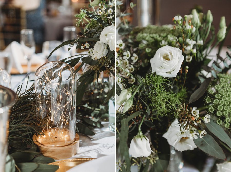 gold table centerpieces of greenery and white flowers