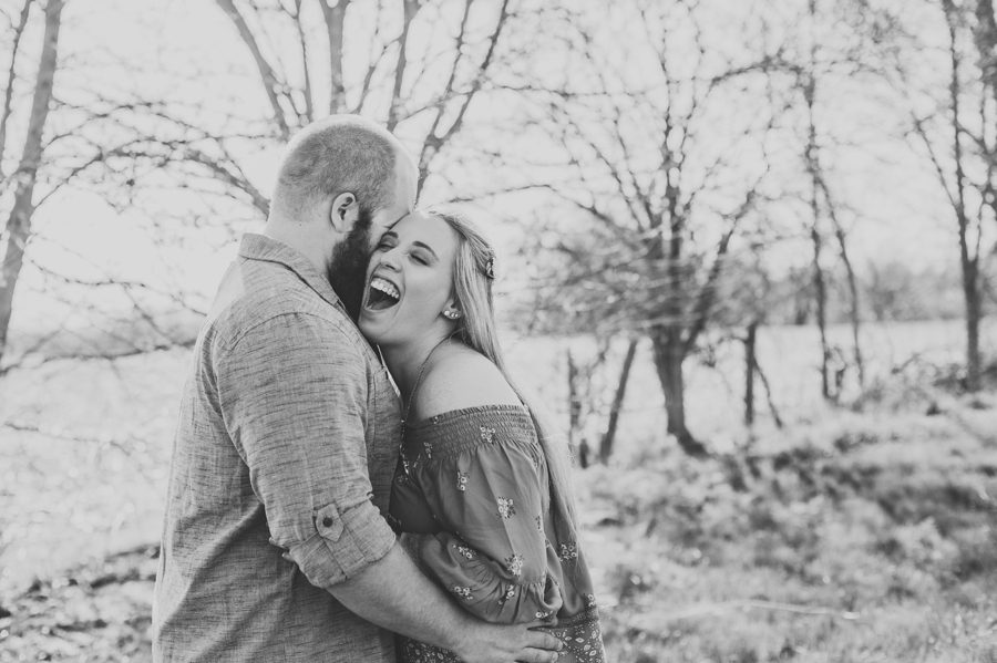 man tickling fiancé at Mt. Sterling Ohio Engagement Photos