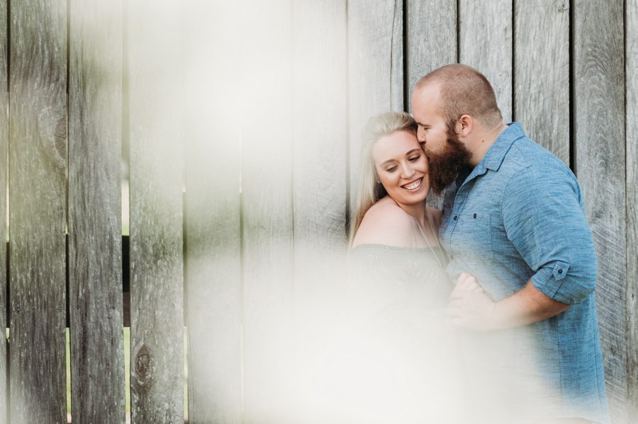 man kissing fiancé on cheek at Mt. Sterling Ohio Engagement Photos
