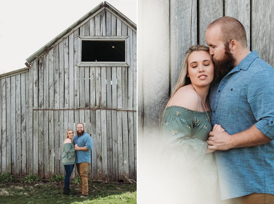 engaged couple standing in front of barn at private property