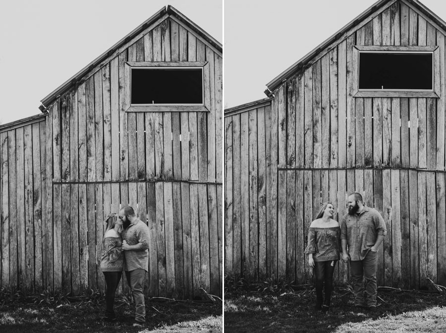 black and white image of engaged couple kissing in front of old barn at Mt. Sterling Ohio Engagement Photos