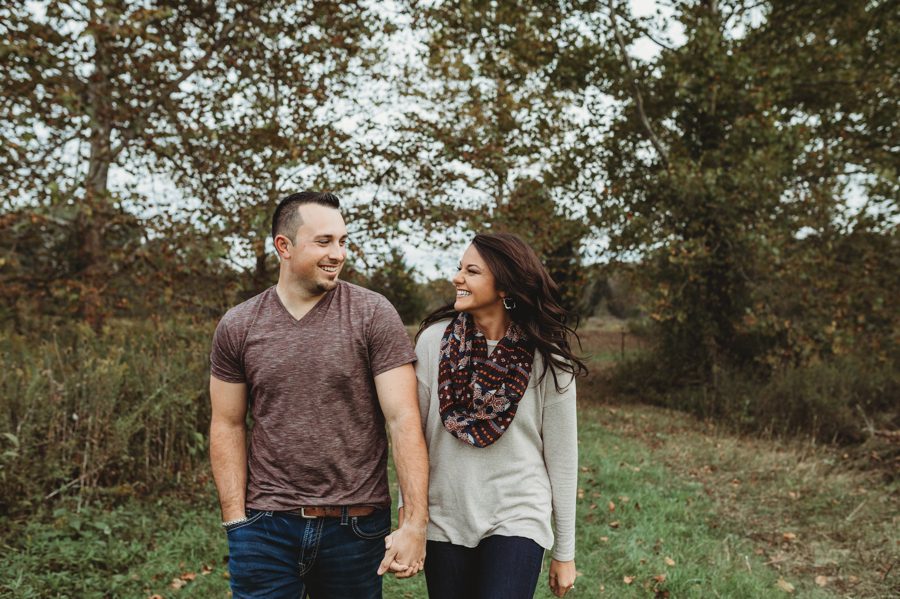 image of engaged couple walking for fall engagement photos