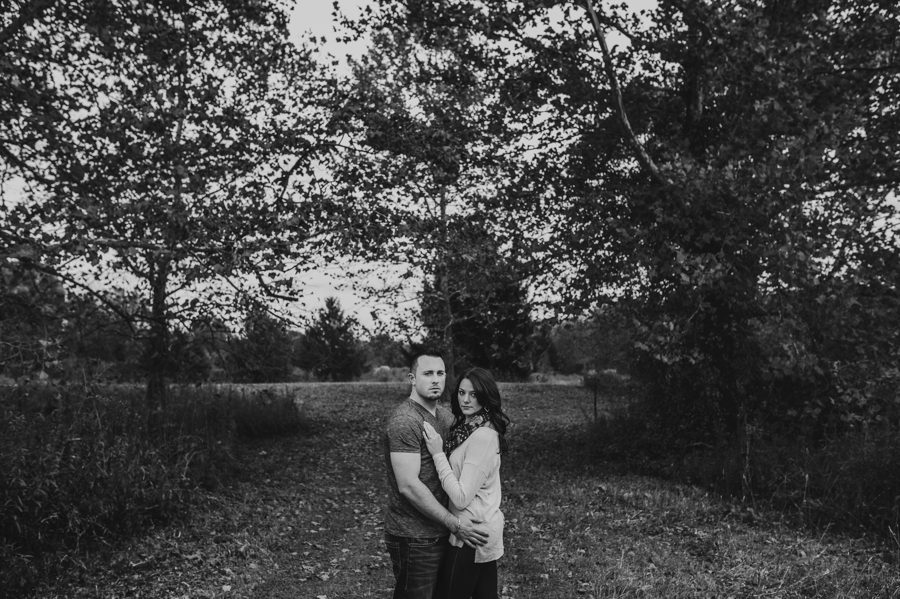 black and white image of engaged couple being serious