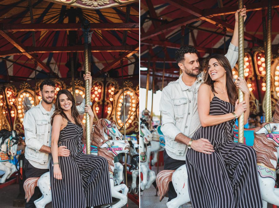 engaged couple smiling on carousel
