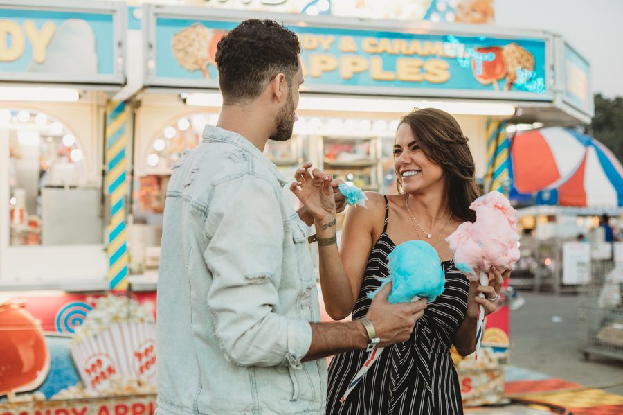 engaged couple eating cotton candy at Columbus Ohio Fair