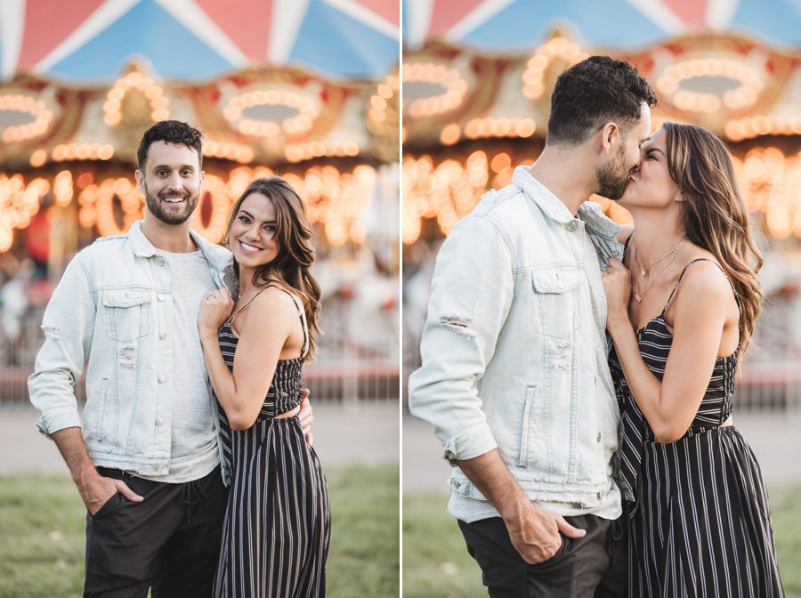 engaged couple in front of carousel