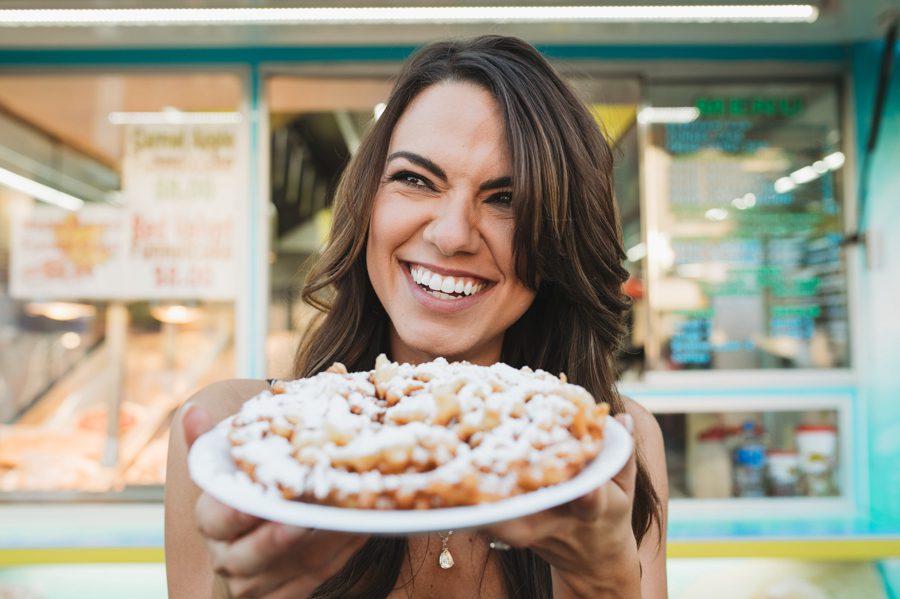 bride to be with funnel cake at fair