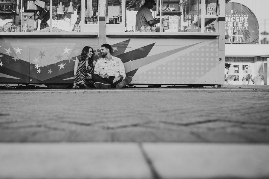 black and white photo of engaged couple at fair