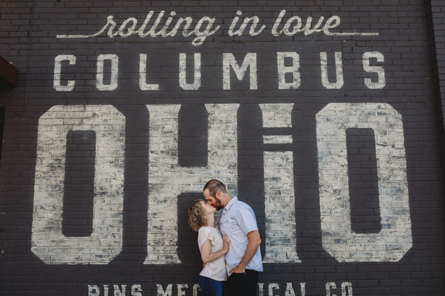 rolling in love Columbus Ohio mural with engaged couple at Pins Mechanical Engagement