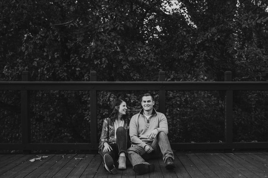 clack and white image of woman and man sitting on wooden planks at Scioto Audubon Metro Park