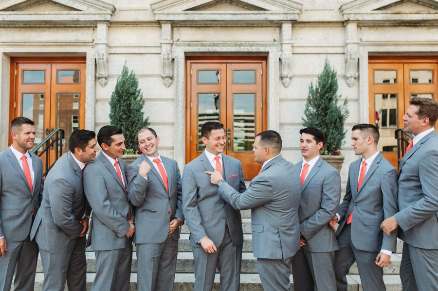 candid photo of groom and groomsmen laughing