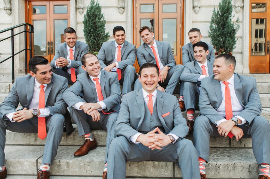 groom and groomsmen sitting on stairs at The Ivory Room Wedding in Columbus Ohio
