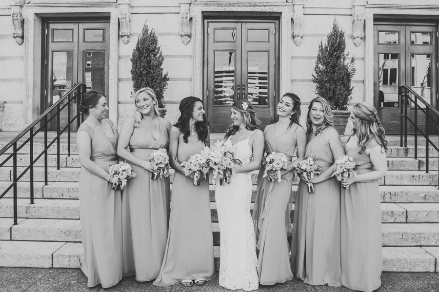 black and white photo of bride and bridesmaids laughing