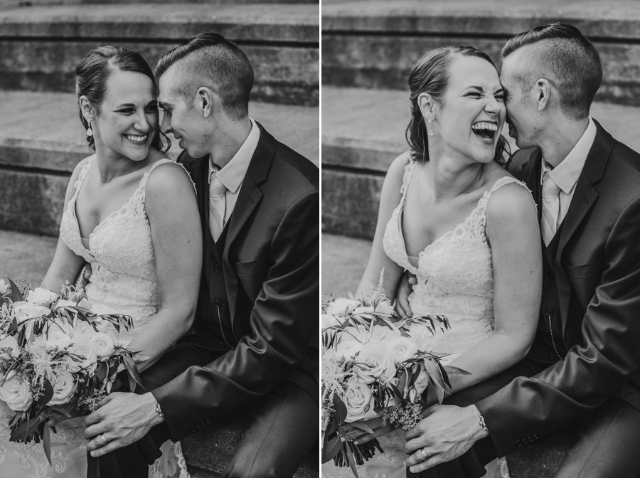 black and white photo of groom making bride laugh out loud