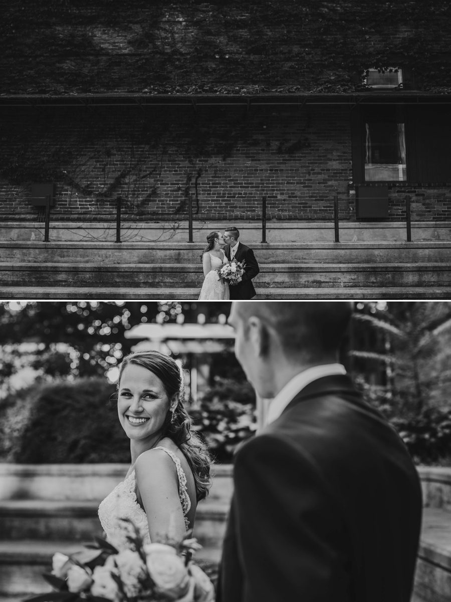 black and white photo of bride looking over her shoulder at groom
