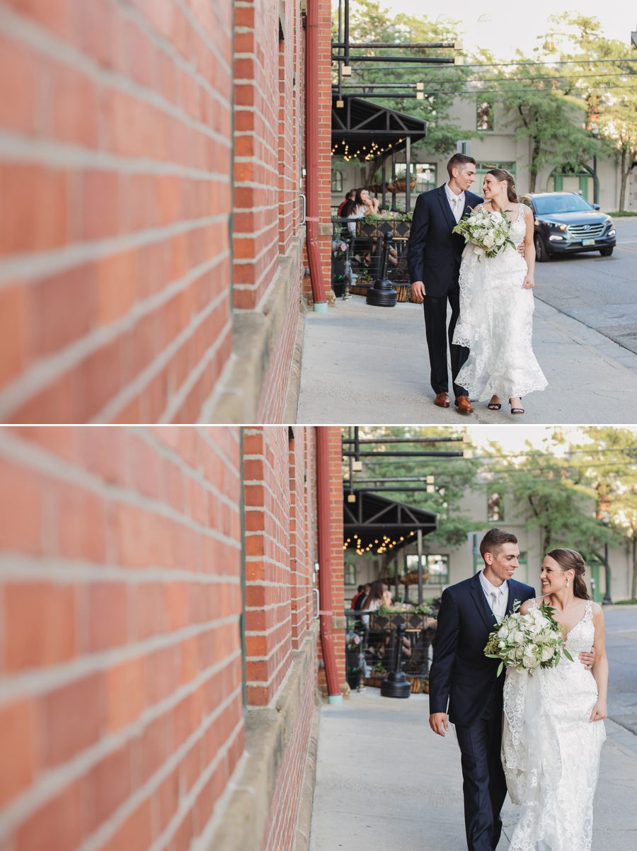 bride and groom walking together on liberty street in Columbus Ohio