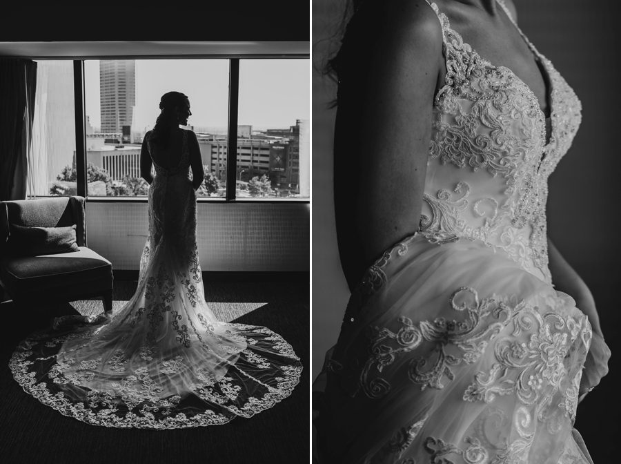 black and white photo of bride standing in front of large window at The Vue Columbus