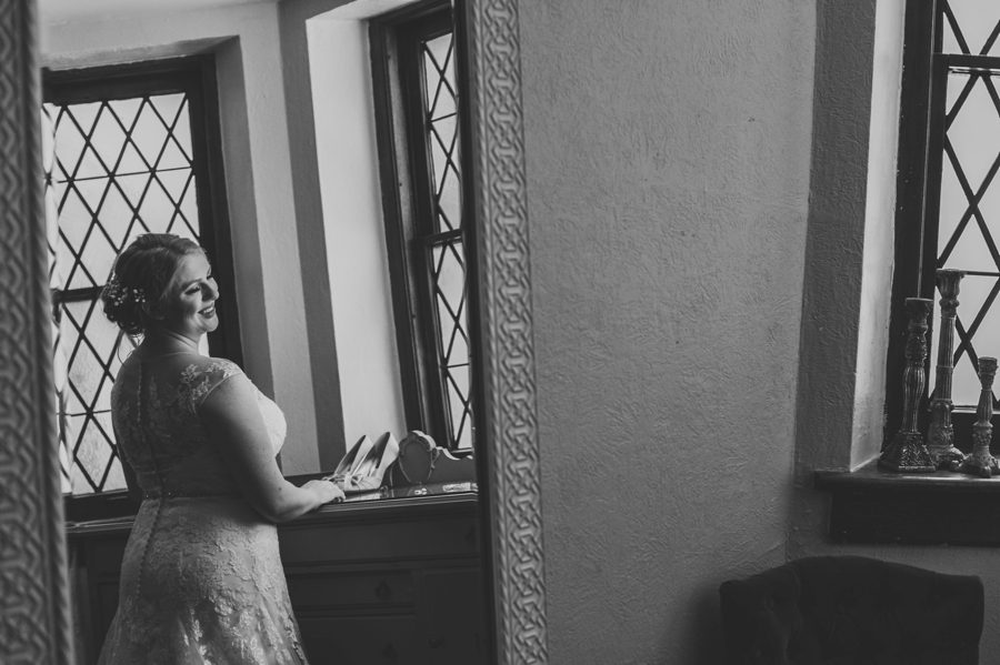 black and white mirror reflection photo of bride