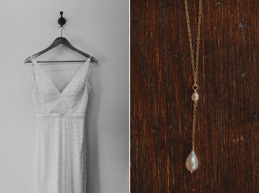 Kelsey's pearl wedding dress in black and white hanging on a hanger