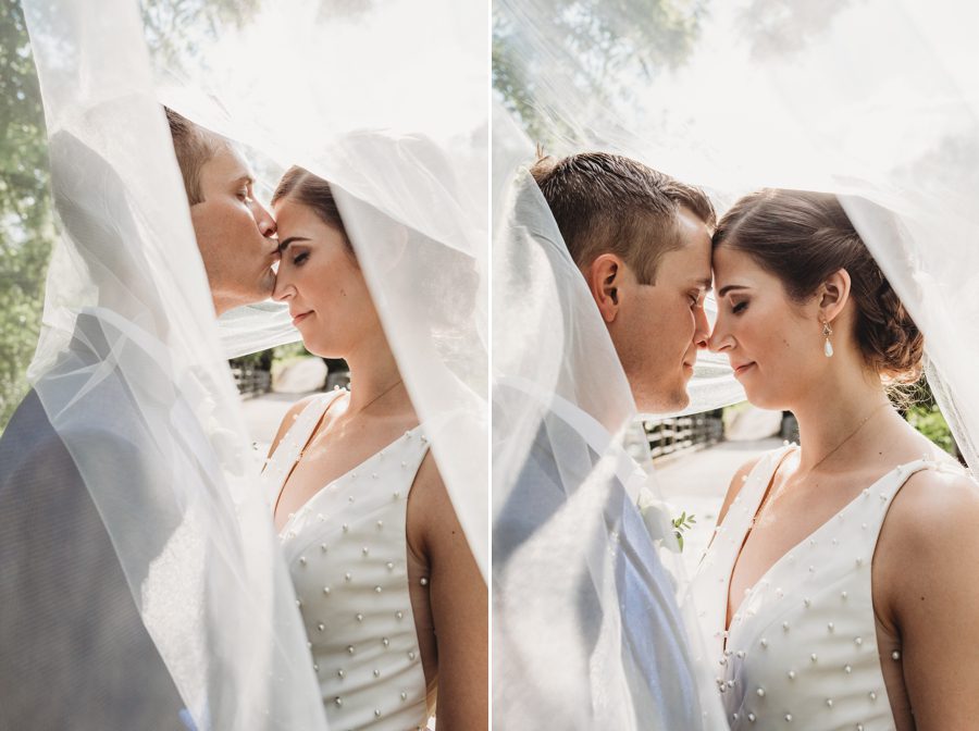 Jon kissing Kelsey on her forehead while under her wedding veil