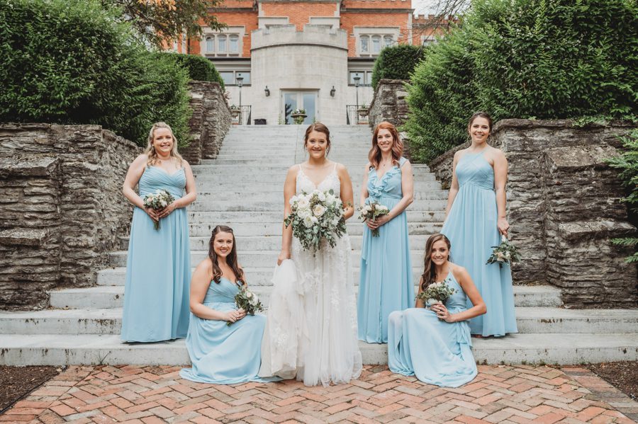 Powder Blue wedding with Emilee and her bridesmaids posing on stairs
