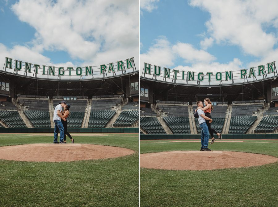 Huntington Park Engagement Photos of man holding fiancé up in air on baseball mound