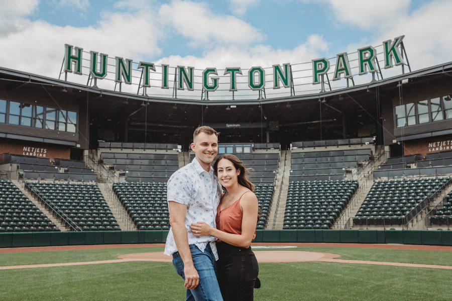 engaged couple hugging and smiling at Huntington Park Engagement Photos